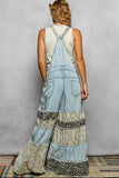 Denim overalls with cheetah and floral patches