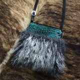 Fluffy hide and turquoise gator purse