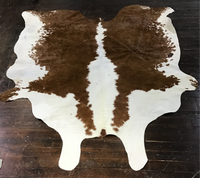 Brown and White Cowhide rug